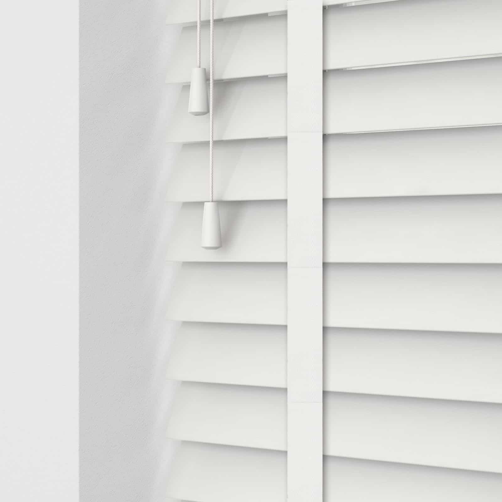 White wooden deals blinds with tapes