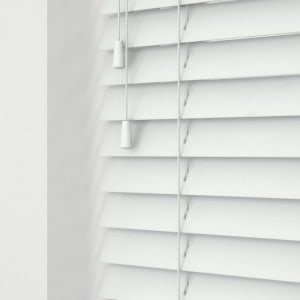 white painted wooden venetian blinds with cords close up